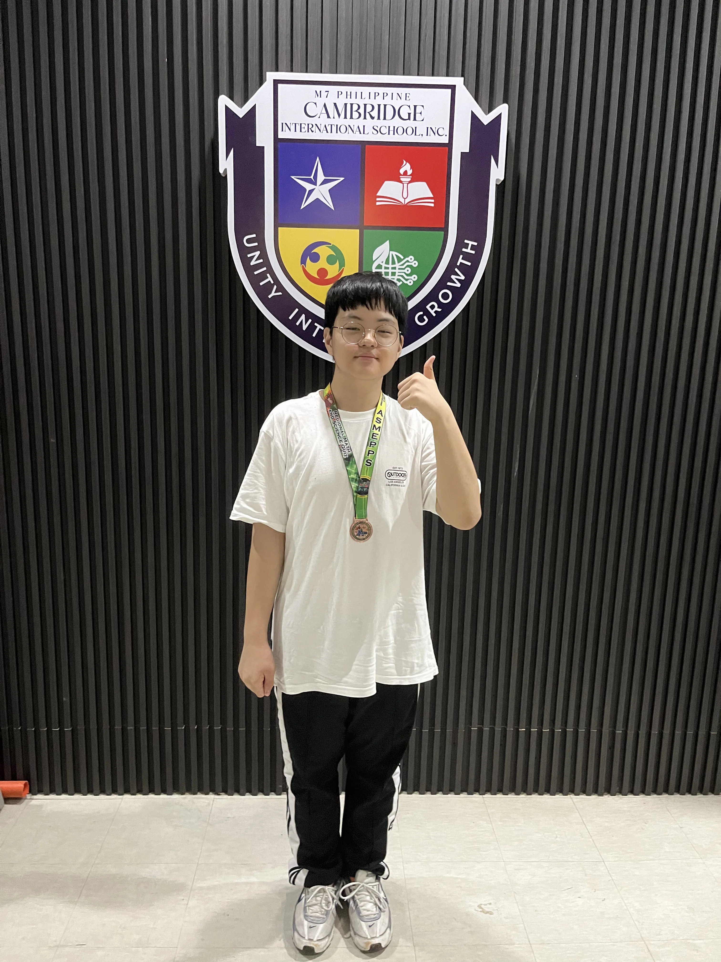 Students participating in a science fair at Philippine Cambridge International School (PCIS), demonstrating their curiosity and enthusiasm for learning through hands-on experiments and presentations.